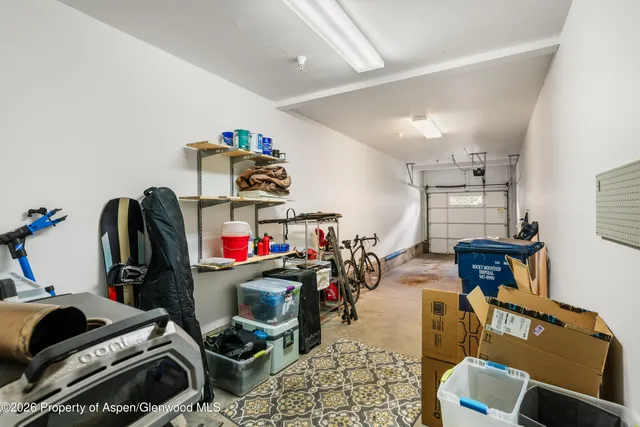 a room with gym equipment and a flat screen tv