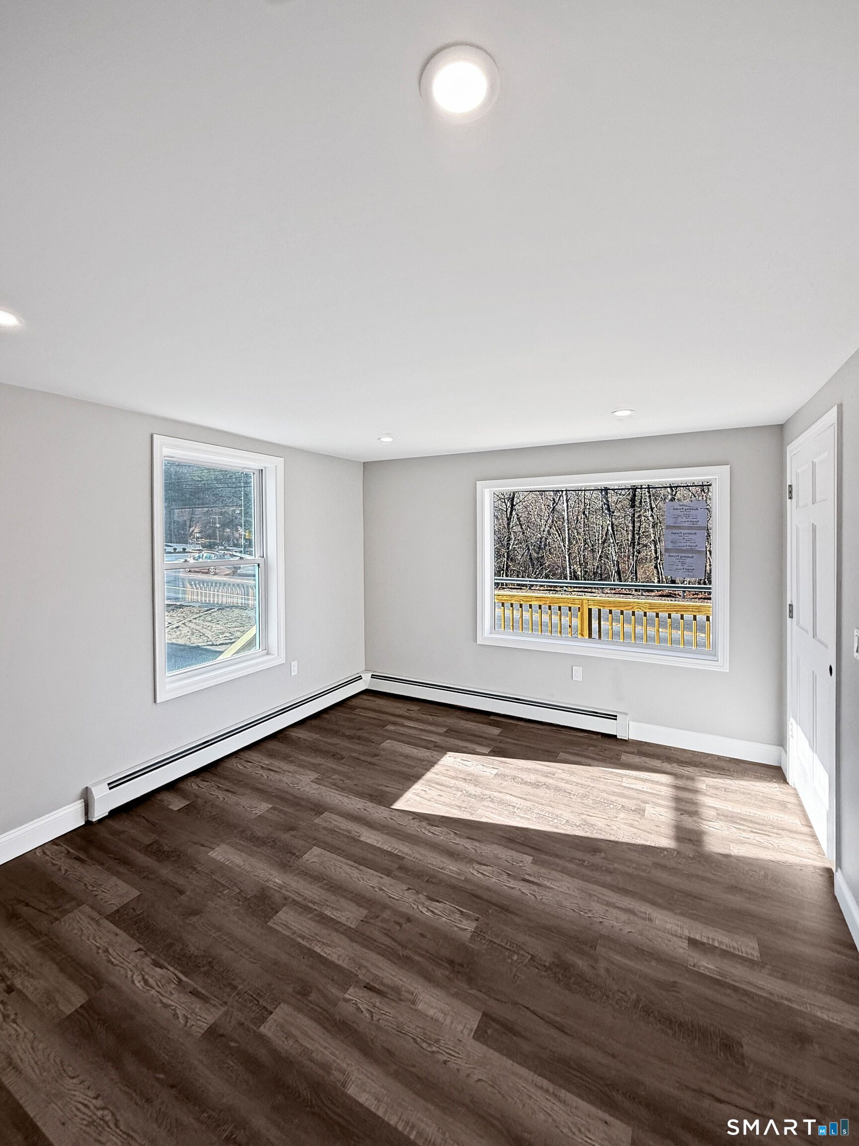 4 River Road, Unit 1 Lisbon, CT 06351 - Photo 13 of 16 a view of an empty room with wooden floor and a window