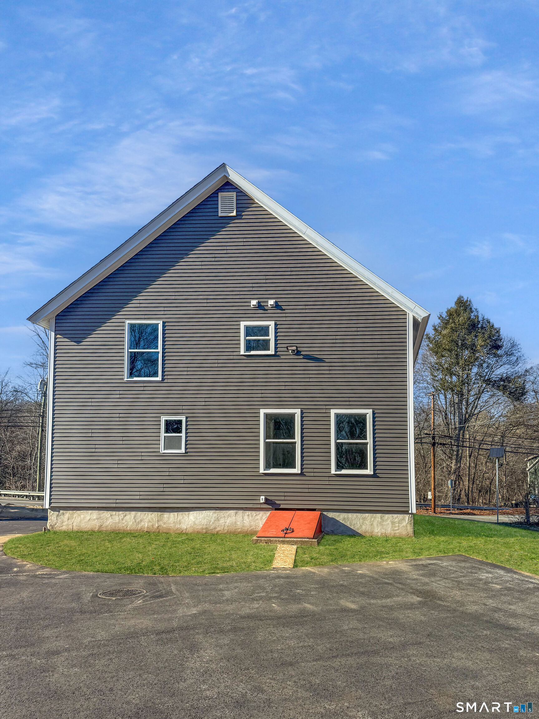 4 River Road, Unit 1 Lisbon, CT 06351 - Photo 15 of 16 a backyard of a house with a yard and garage