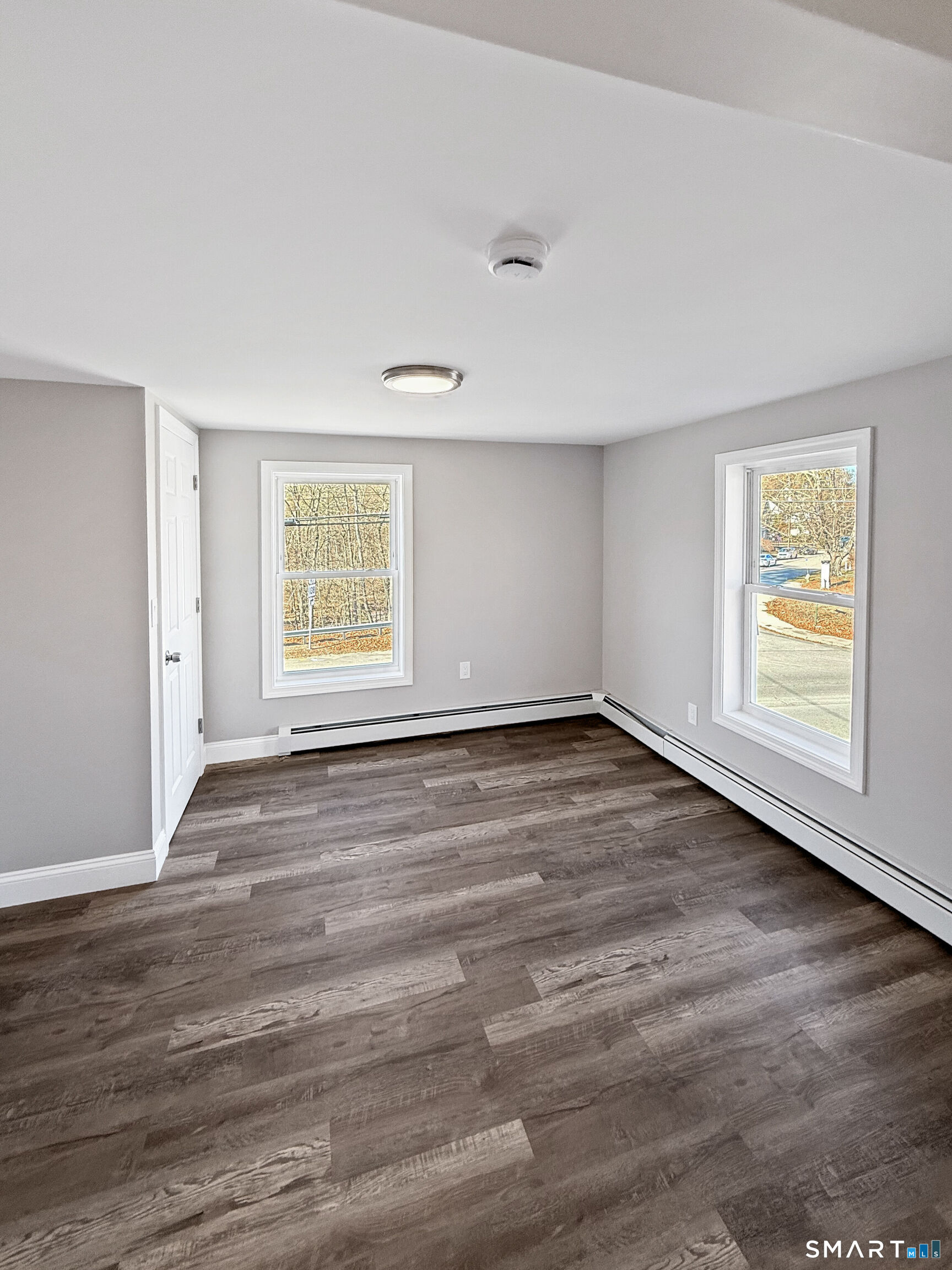 4 River Road, Unit 1 Lisbon, CT 06351 - Photo 8 of 16 an empty room with wooden floor and windows
