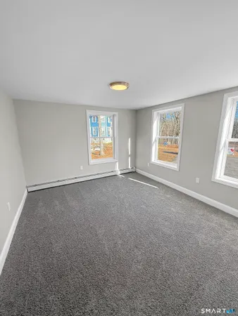 a view of an empty room with windows