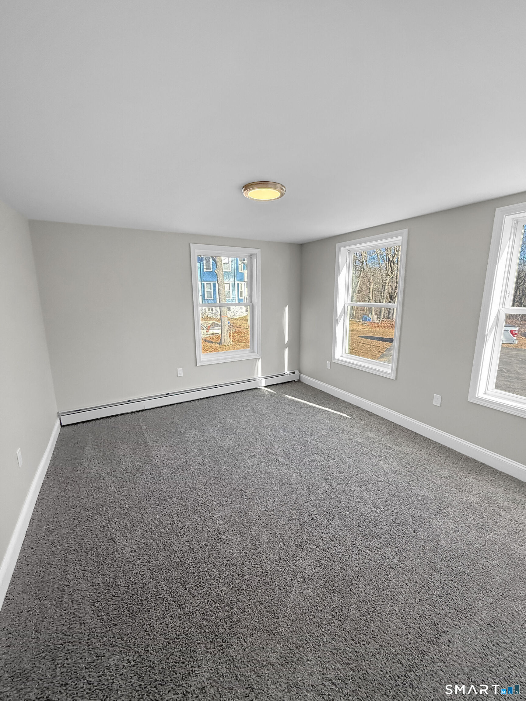 4 River Road, Unit 1 Lisbon, CT 06351 - Photo 10 of 16 an empty room with windows and closet