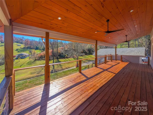 a view of a balcony with wooden floor