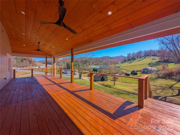 a view of a balcony with wooden floor