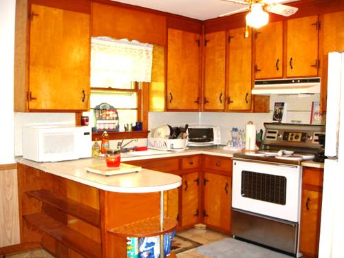 781 Roberson Mill Road Southeast Floyd, VA 24091 - Photo 2 of 7 a kitchen with a sink stove and cabinets