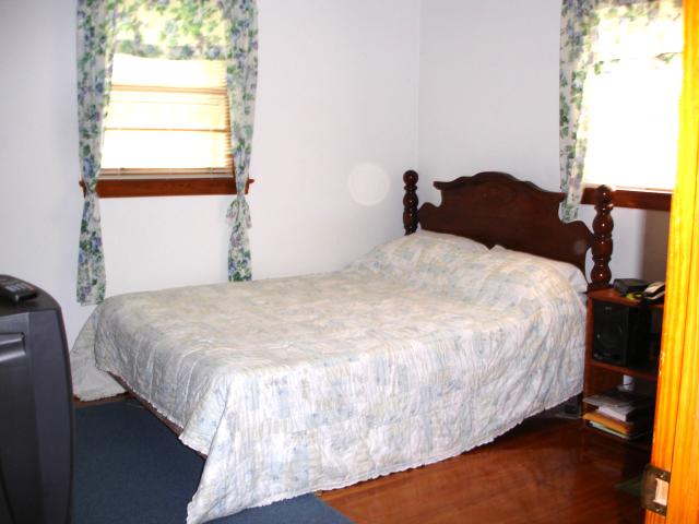781 Roberson Mill Road Southeast Floyd, VA 24091 - Photo 5 of 7 a bedroom with a bed and a window