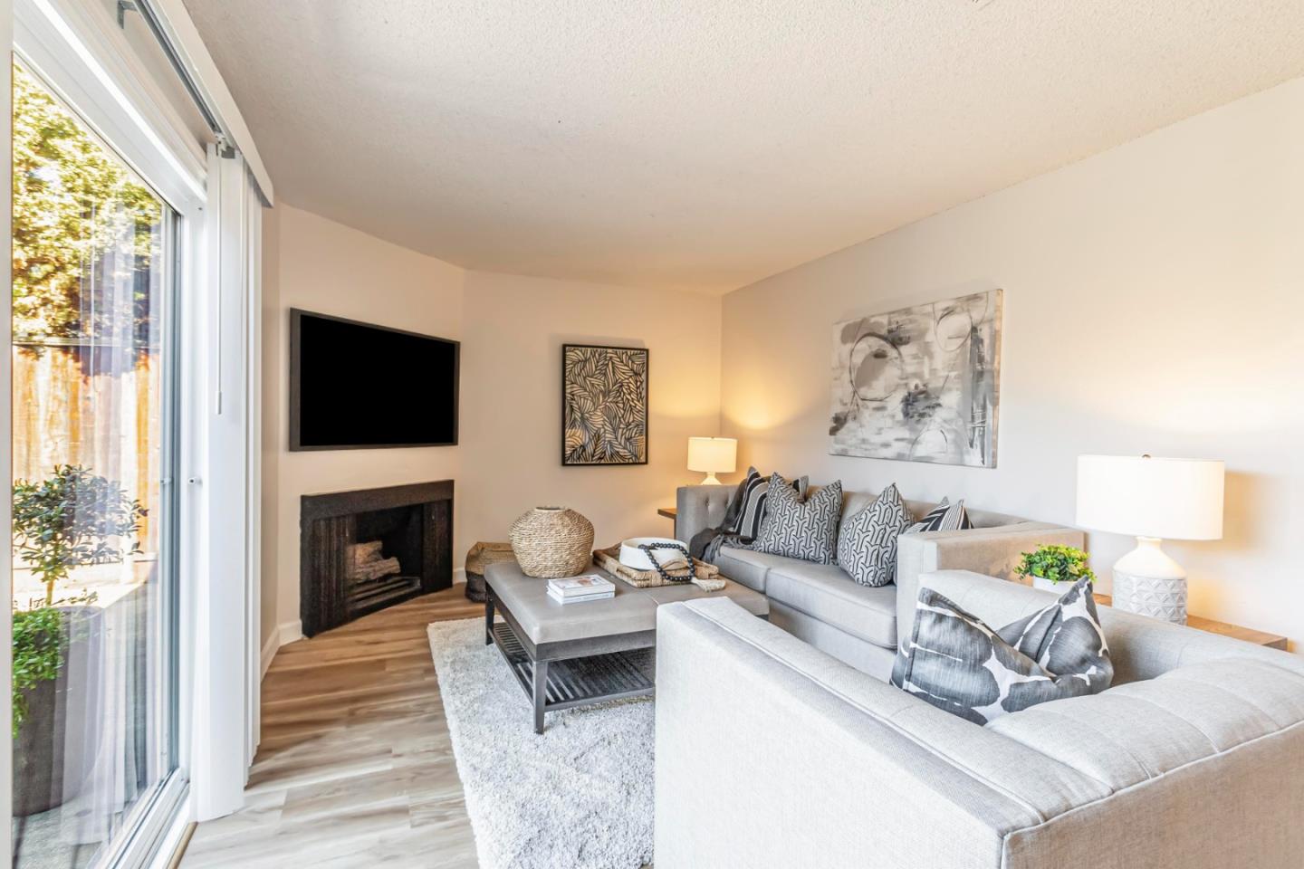 1726 Merrill Loop San Jose, CA 95124 - Photo 12 of 41 a living room with furniture a fireplace and a flat screen tv