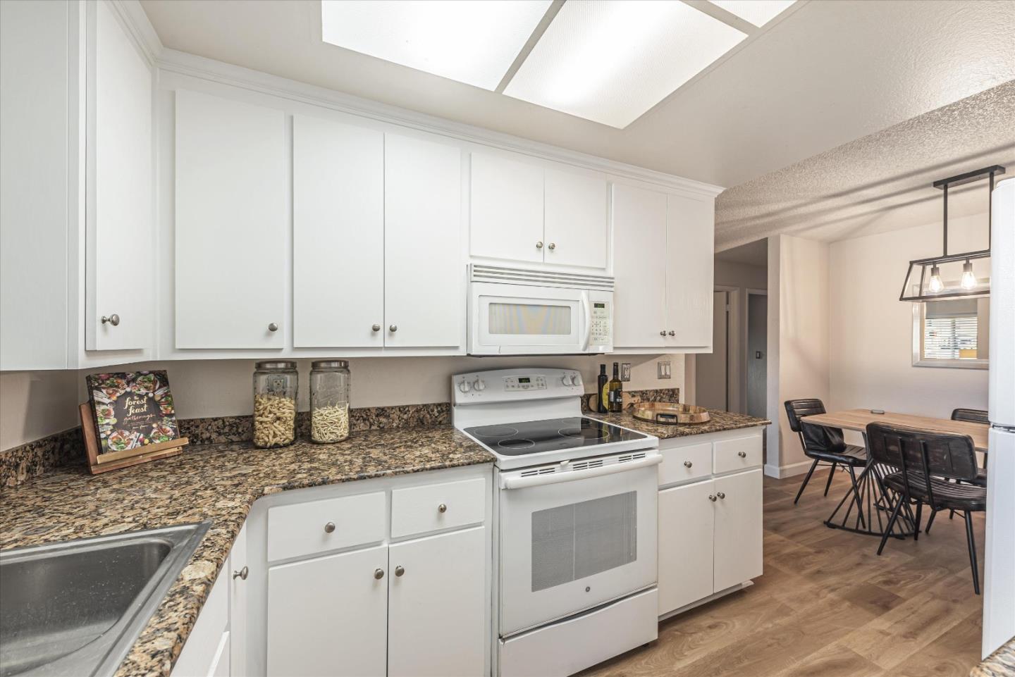 1726 Merrill Loop San Jose, CA 95124 - Photo 14 of 41 a kitchen with stainless steel appliances granite countertop a sink stove and cabinets
