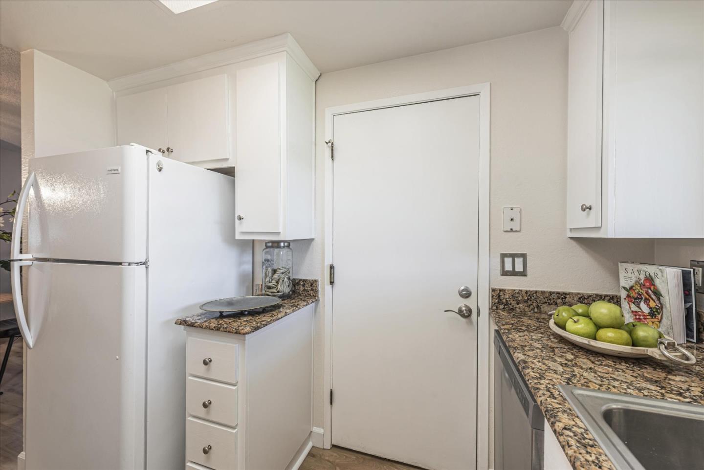 1726 Merrill Loop San Jose, CA 95124 - Photo 17 of 41 a kitchen with stainless steel appliances granite countertop a refrigerator sink and stove