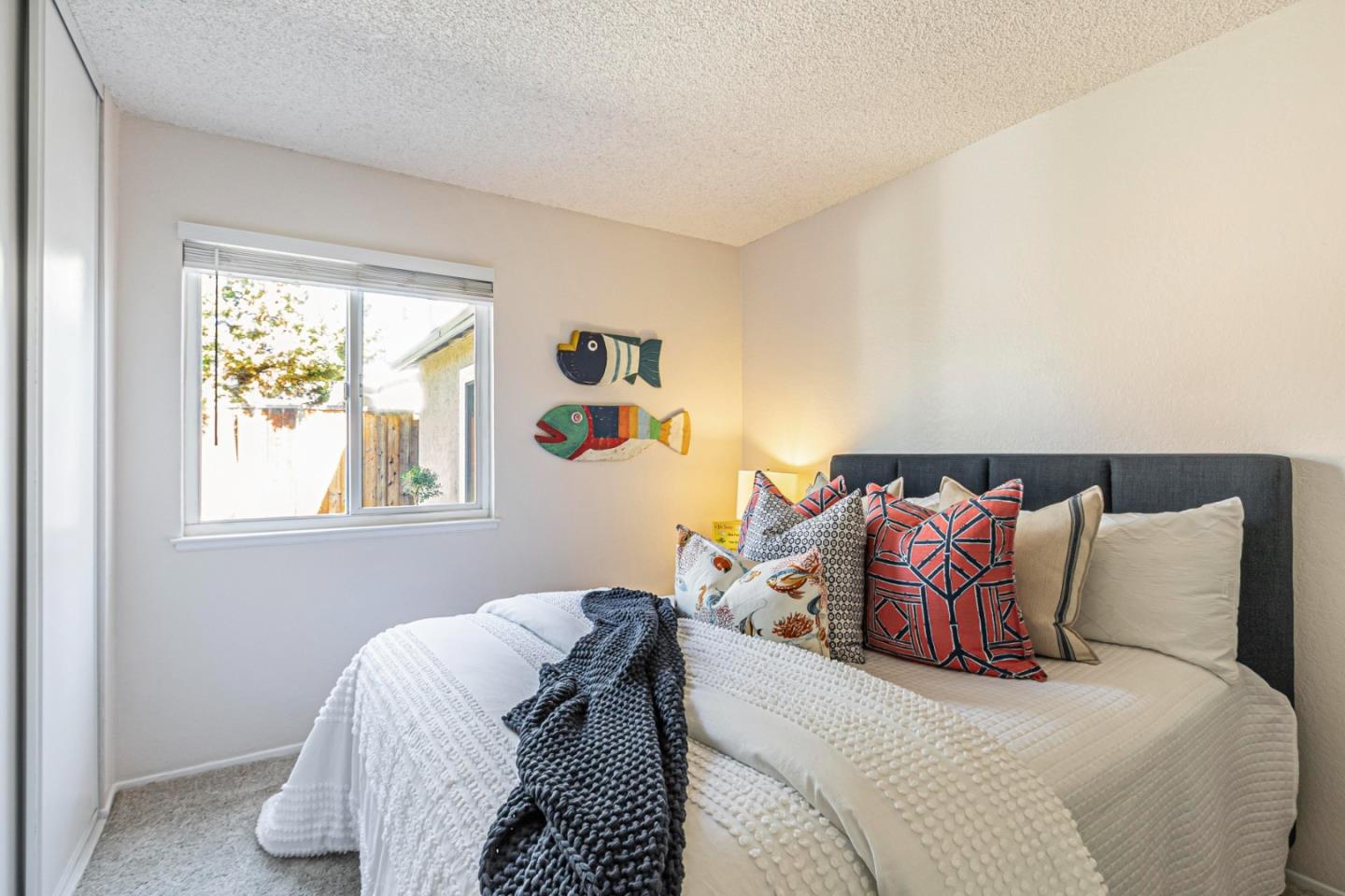 1726 Merrill Loop San Jose, CA 95124 - Photo 27 of 41 a bed sitting in a bedroom next to a window