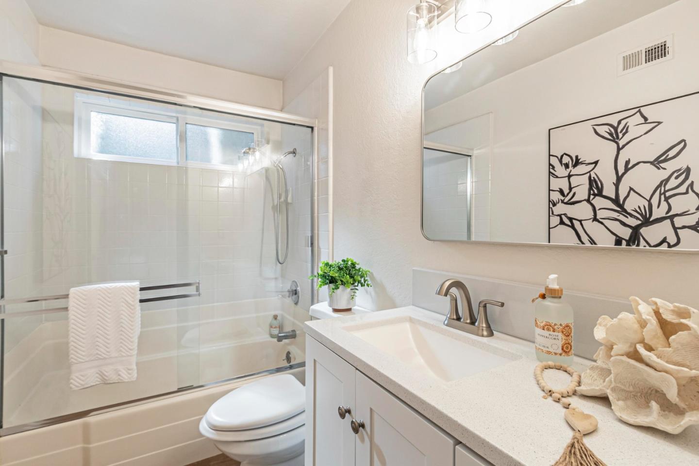 1726 Merrill Loop San Jose, CA 95124 - Photo 30 of 41 a bathroom with a granite countertop sink toilet a mirror and shower