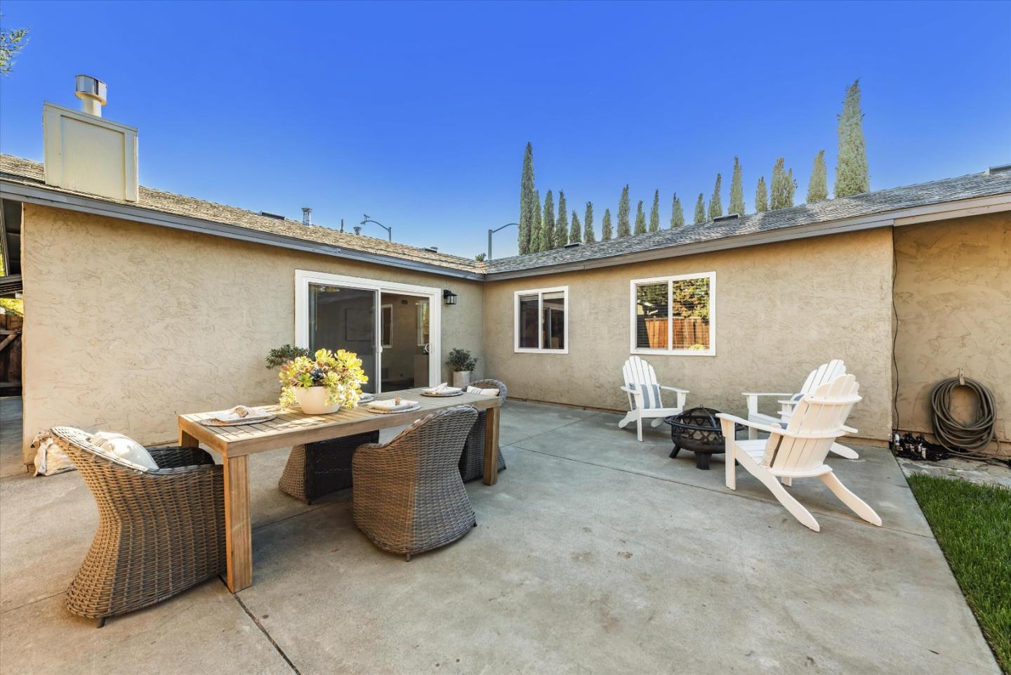 1726 Merrill Loop San Jose, CA 95124 - Photo 32 of 41 a view of a patio with table and chairs near a road