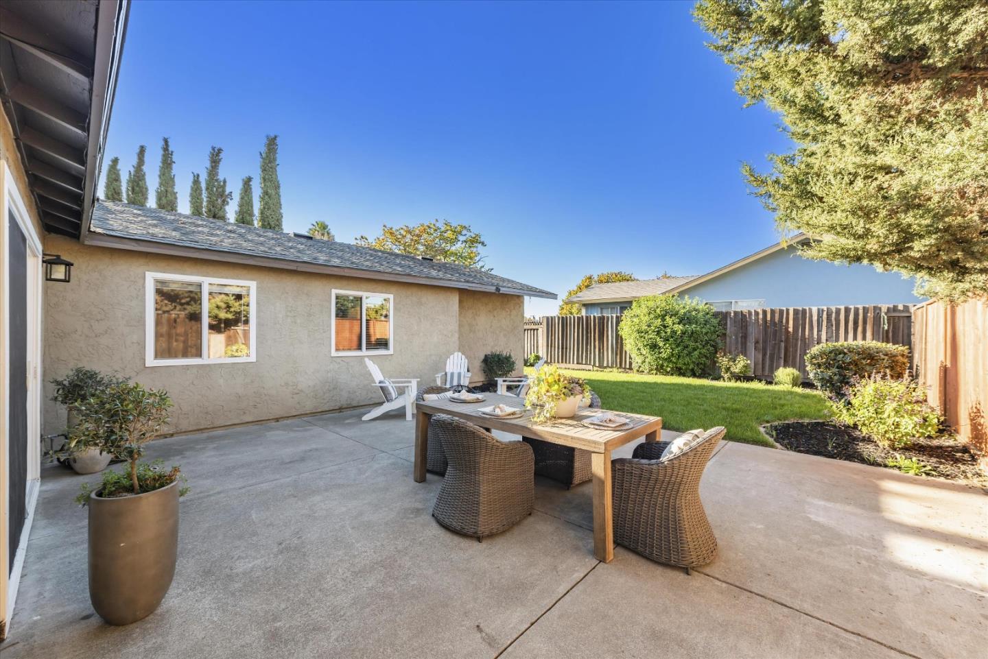 1726 Merrill Loop San Jose, CA 95124 - Photo 33 of 41 a view of a patio with couches chairs potted plants and wooden fence