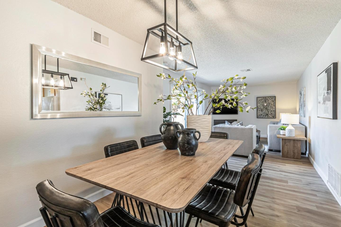 1726 Merrill Loop San Jose, CA 95124 - Photo 8 of 41 a view of a dining room with furniture a chandelier and wooden floor