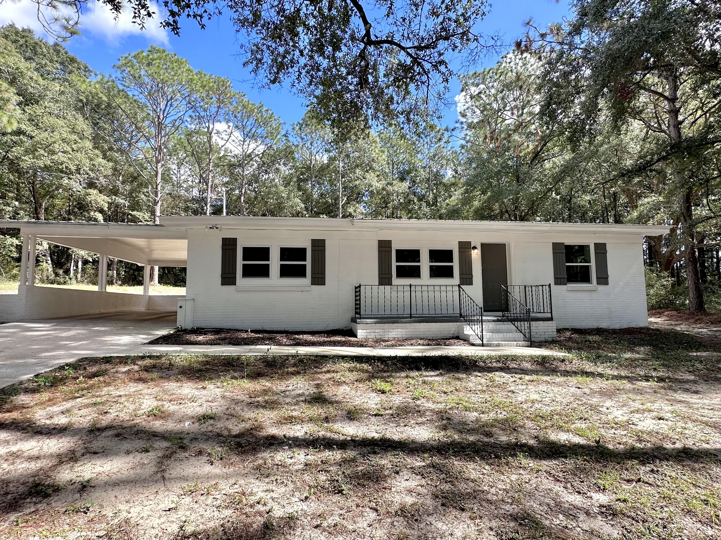 a view of a house with backyard