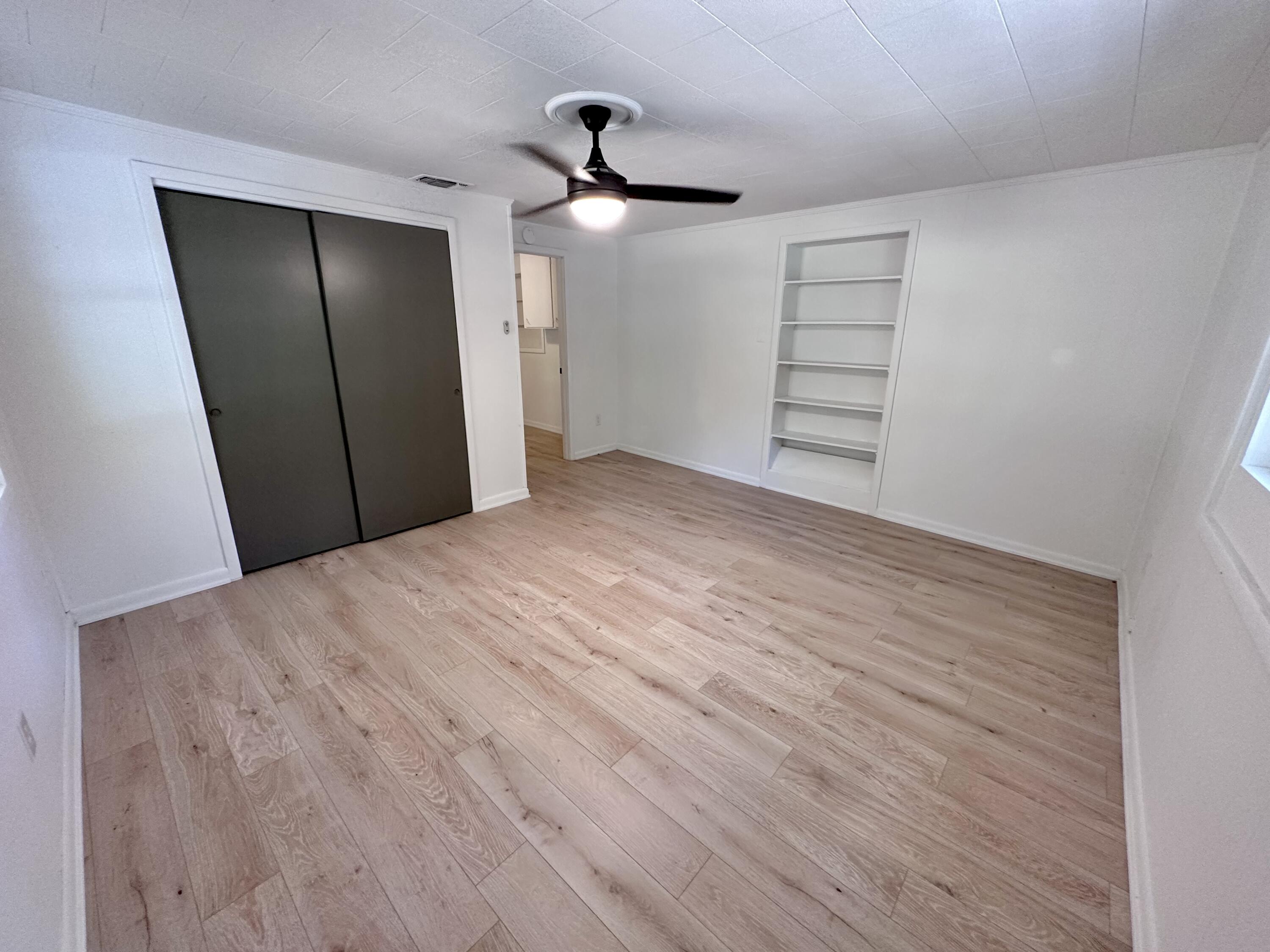 159 Smith Street Crestview, FL 32539 - Photo 11 of 29 a view of empty room with wooden floor