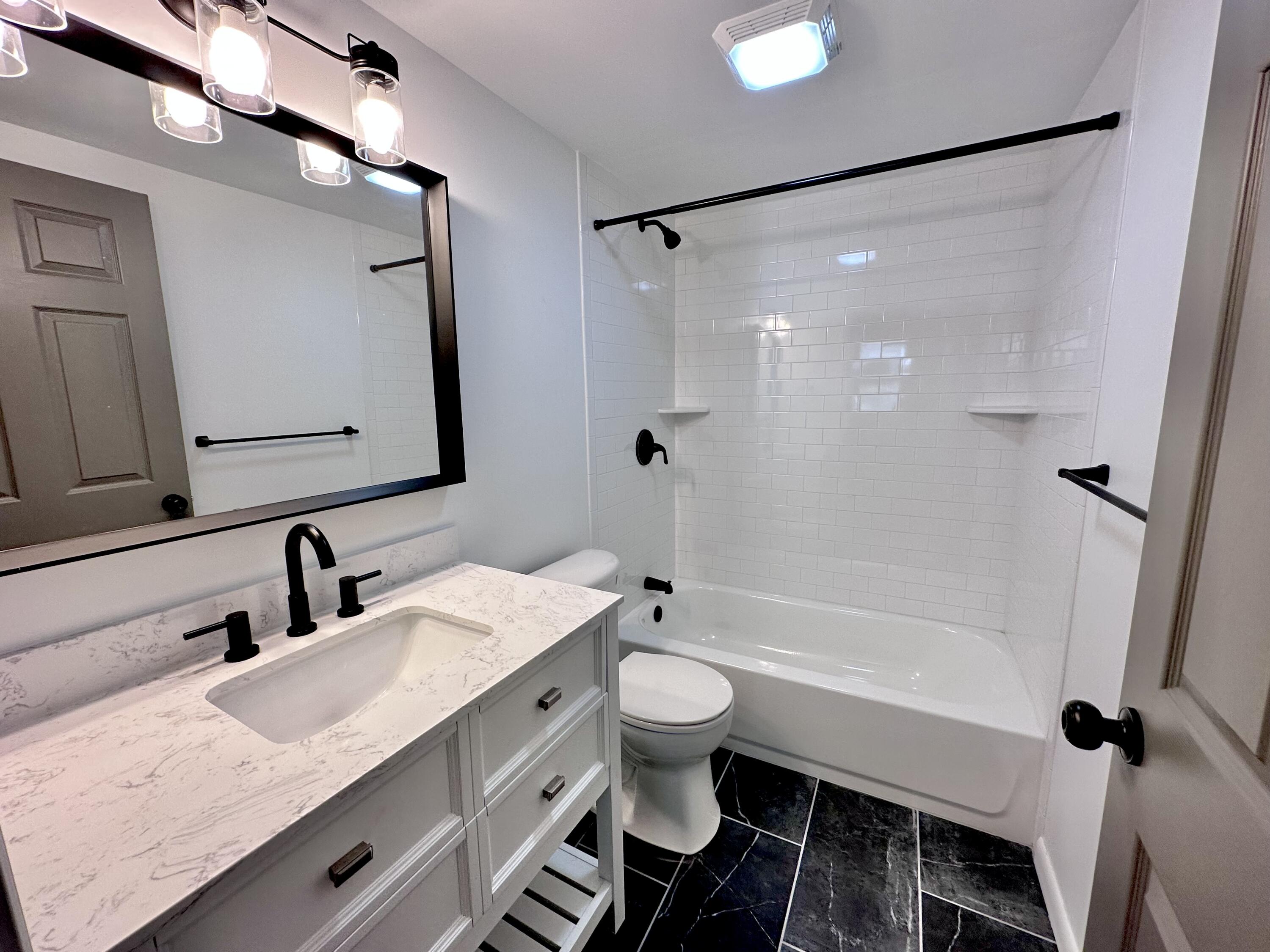 159 Smith Street Crestview, FL 32539 - Photo 14 of 29 a bathroom with a granite countertop sink toilet and shower