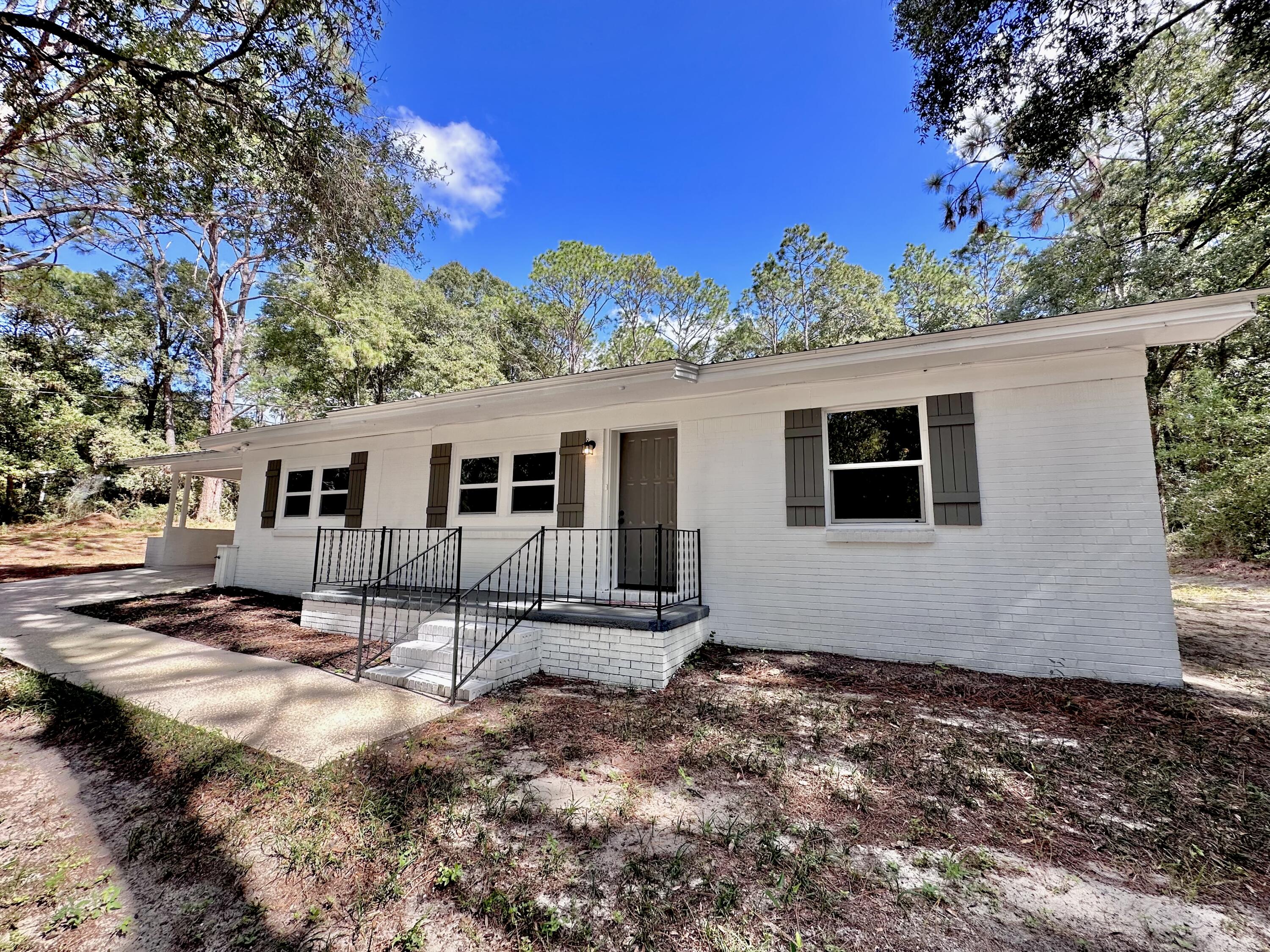159 Smith Street Crestview, FL 32539 - Photo 2 of 29 a view of a house with a yard