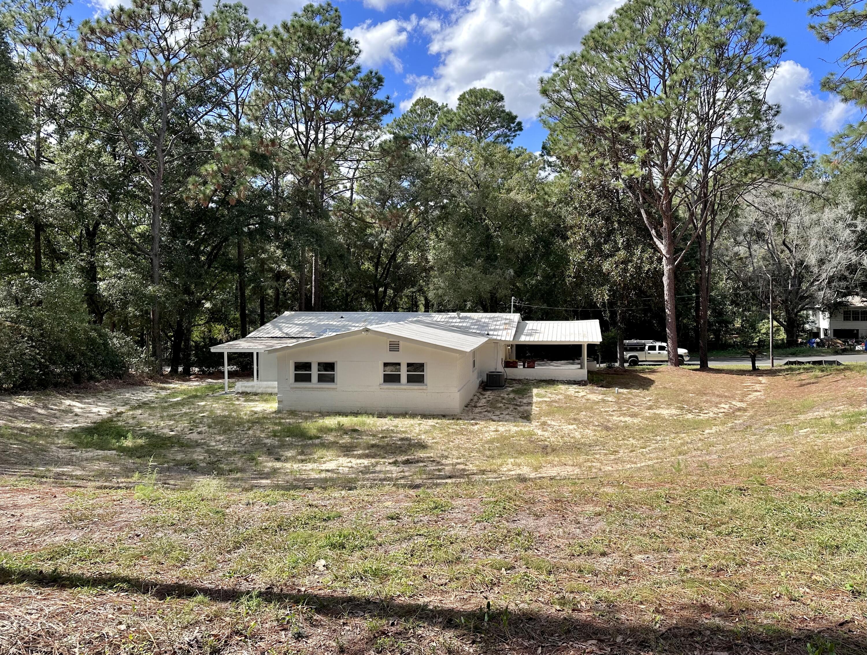 159 Smith Street Crestview, FL 32539 - Photo 27 of 29 a backyard of a house with table and chairs