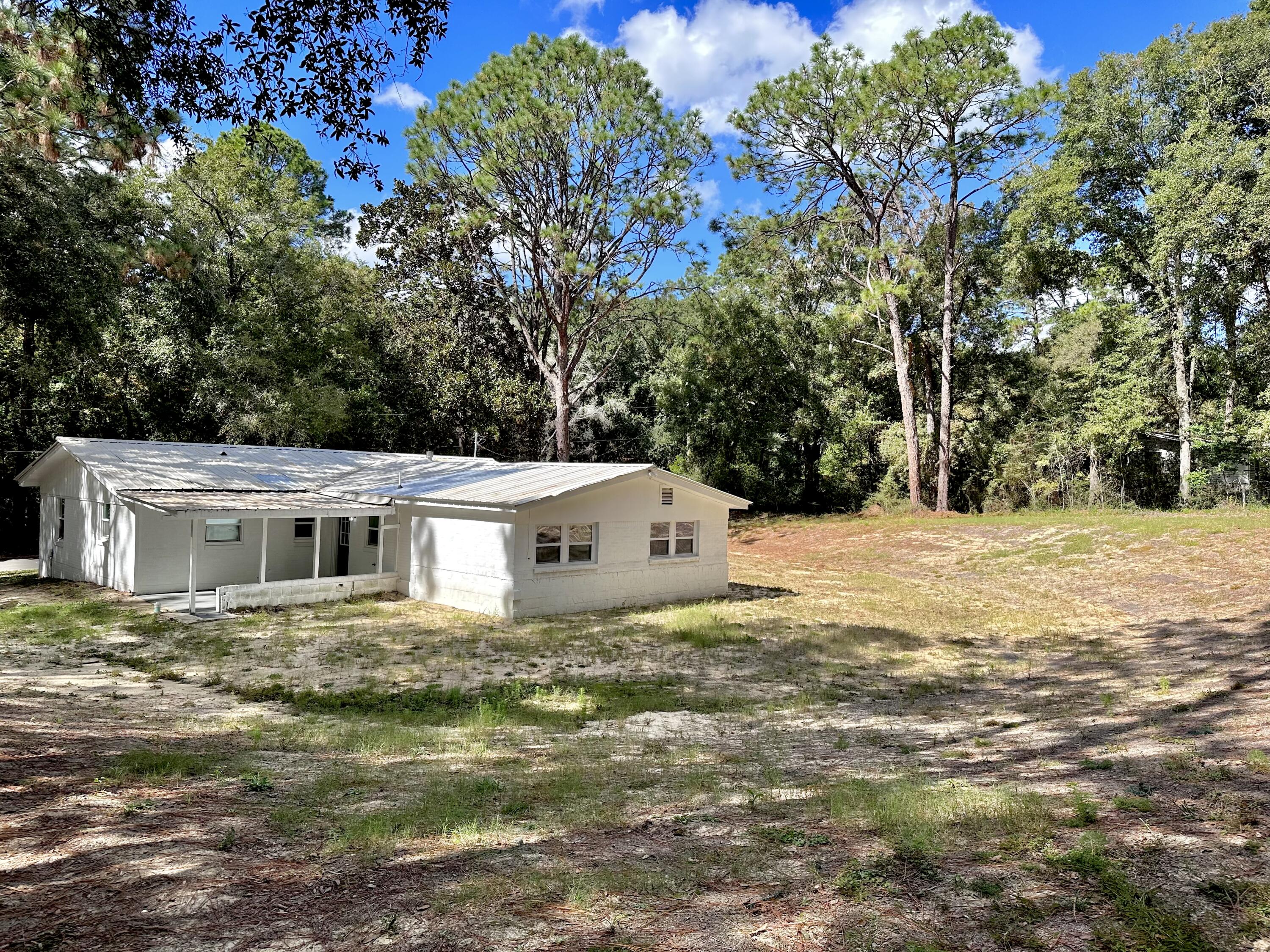 159 Smith Street Crestview, FL 32539 - Photo 28 of 29 a house with a tree in front of it