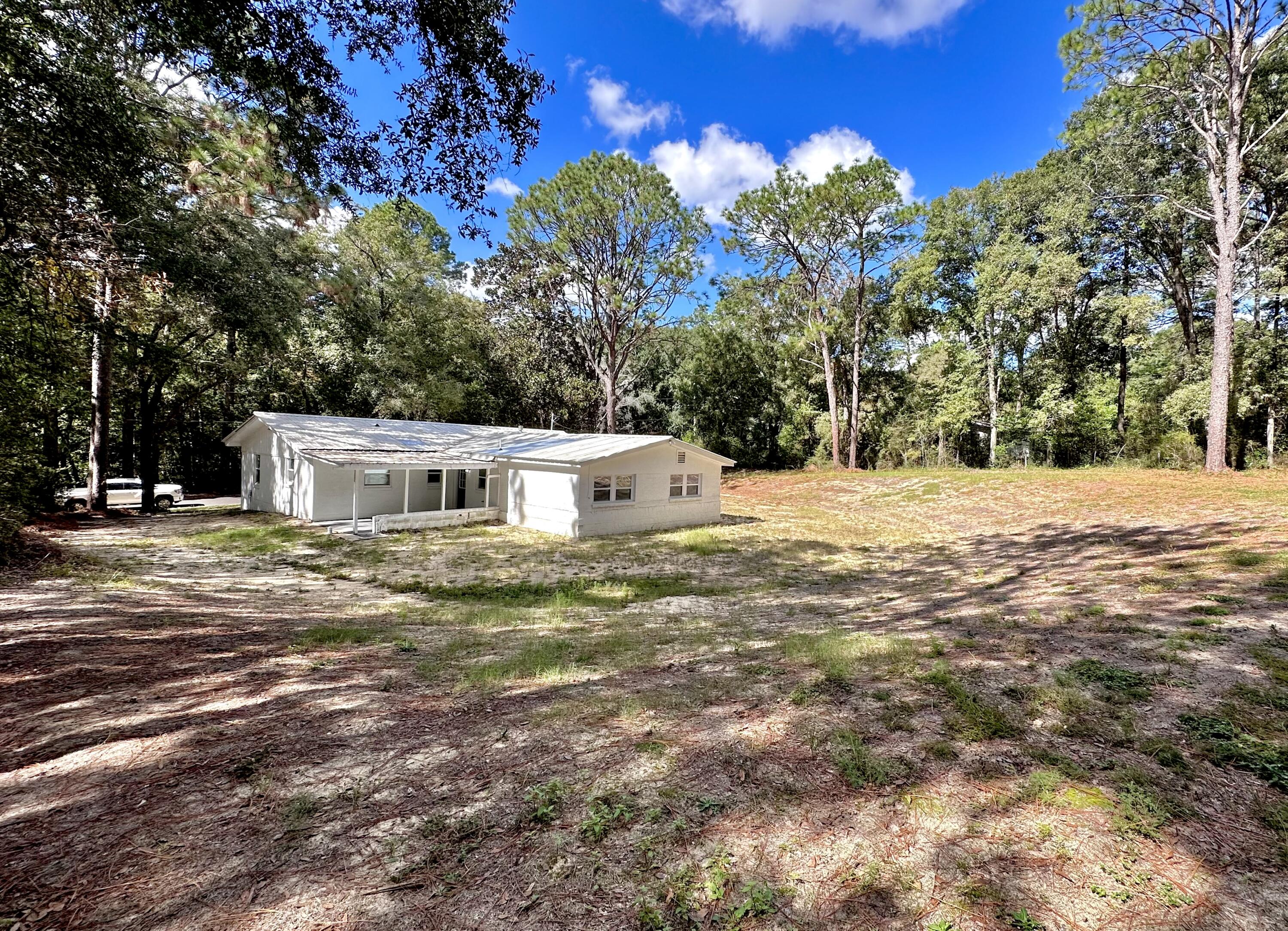 159 Smith Street Crestview, FL 32539 - Photo 29 of 29 a view of a house with a yard