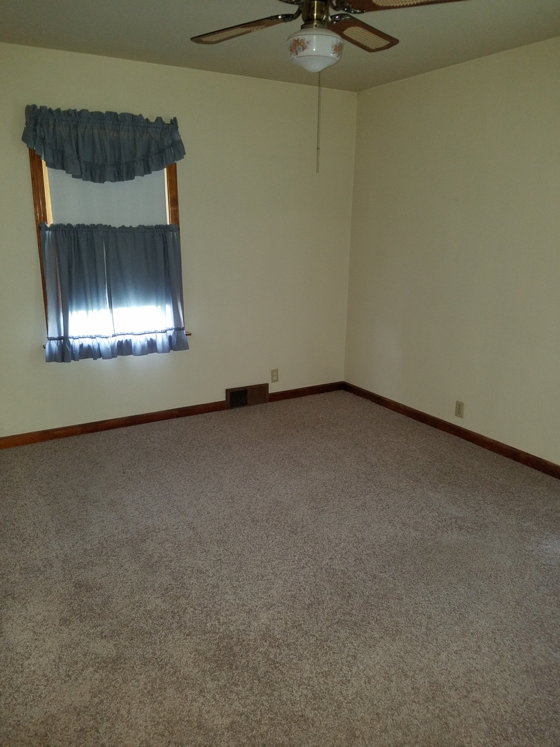 950 North 12th Street Rochelle, IL 61068 - Photo 11 of 18 a view of room with a fireplace