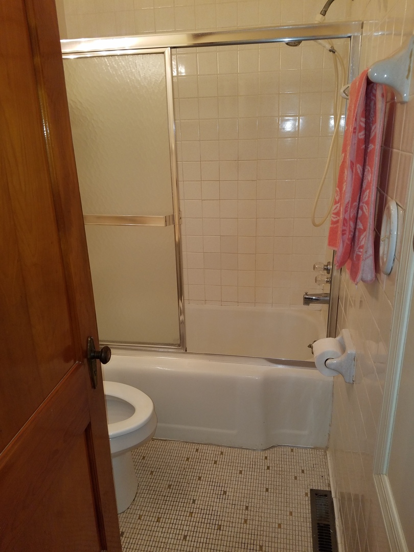 950 North 12th Street Rochelle, IL 61068 - Photo 12 of 18 a bathroom with a shower a toilet and sink