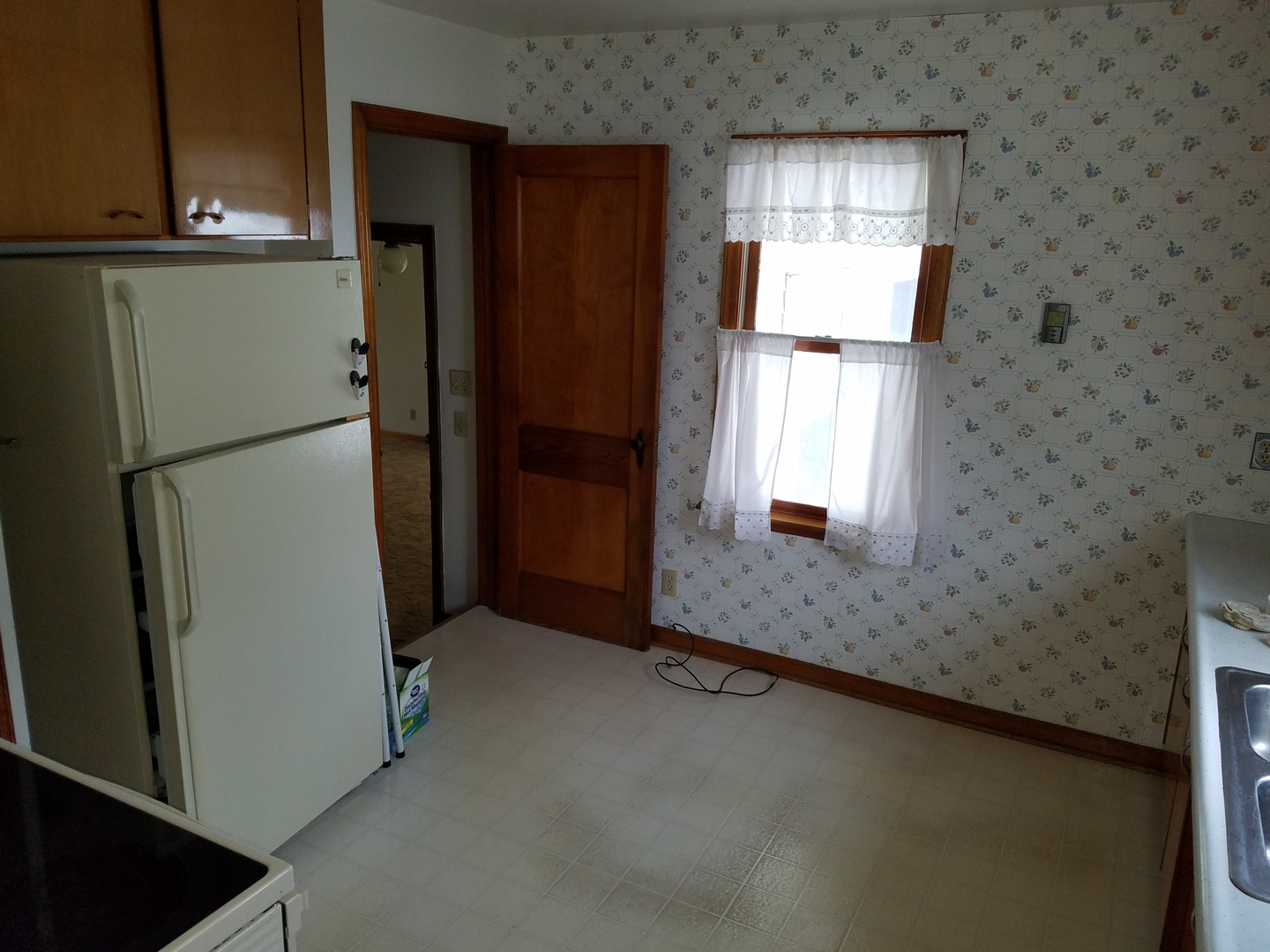 950 North 12th Street Rochelle, IL 61068 - Photo 4 of 18 a kitchen with refrigerator and window