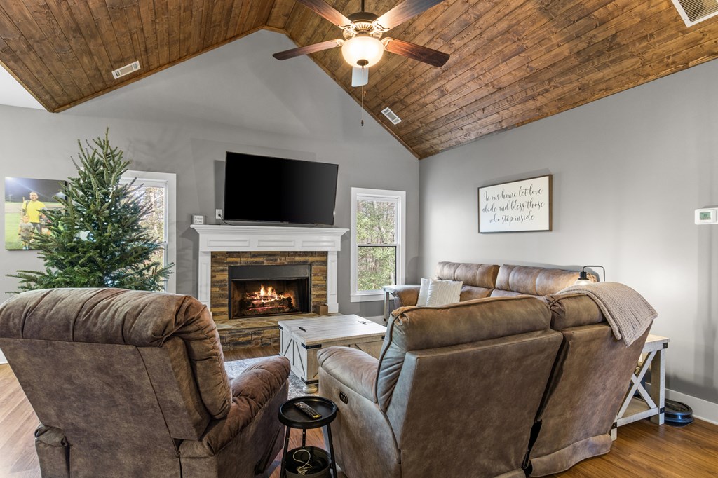 41 Brumby Trail Ellijay, GA 30536 - Photo 13 of 39 a living room with furniture a flat screen tv and a fireplace
