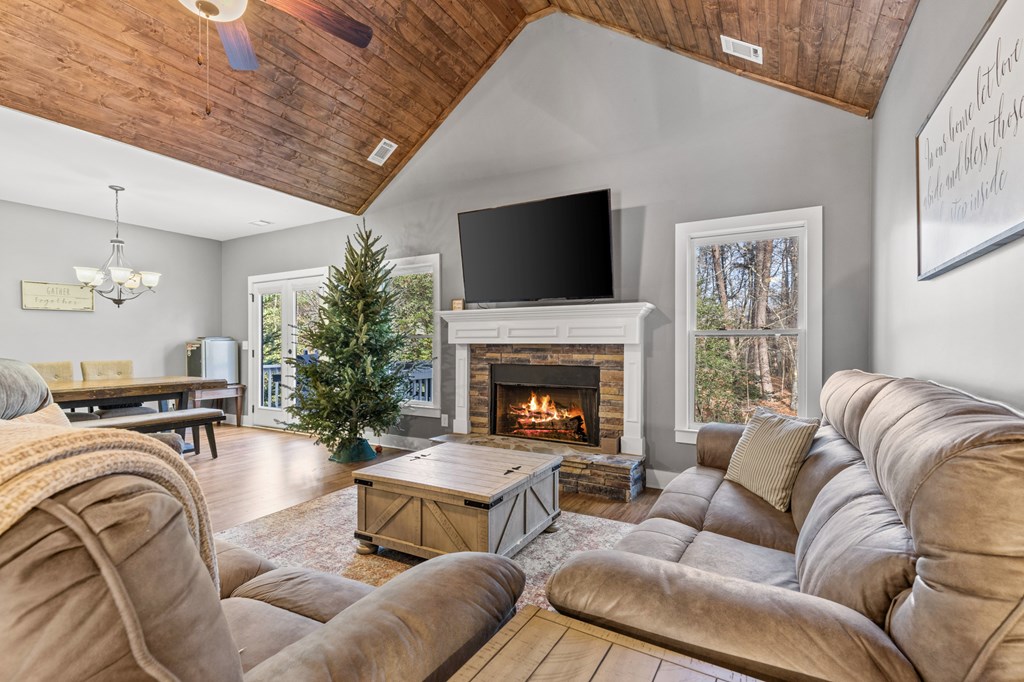 41 Brumby Trail Ellijay, GA 30536 - Photo 14 of 39 a living room with furniture a flat screen tv and a fireplace