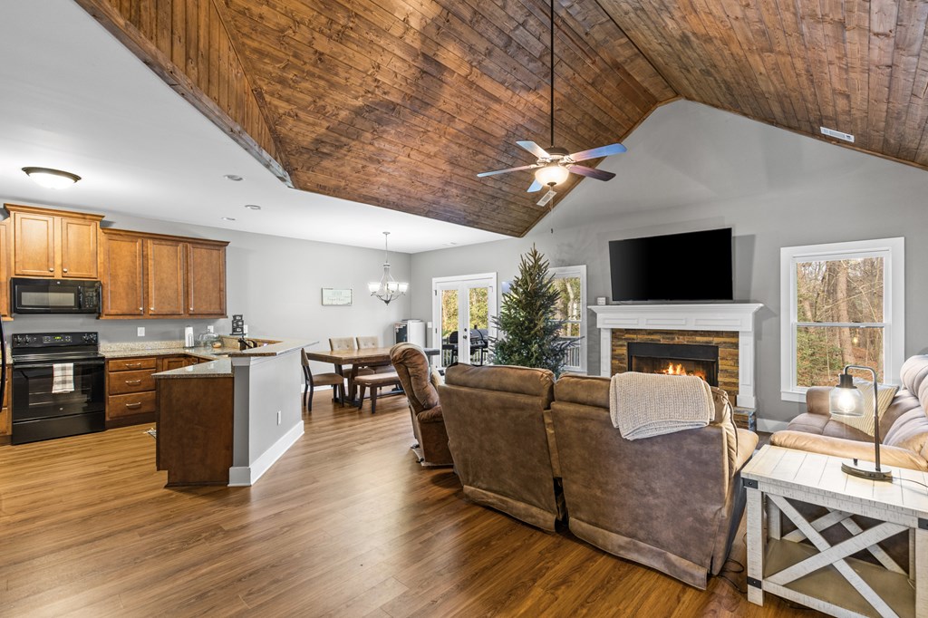 41 Brumby Trail Ellijay, GA 30536 - Photo 19 of 39 a living room with furniture a fireplace and a flat screen tv