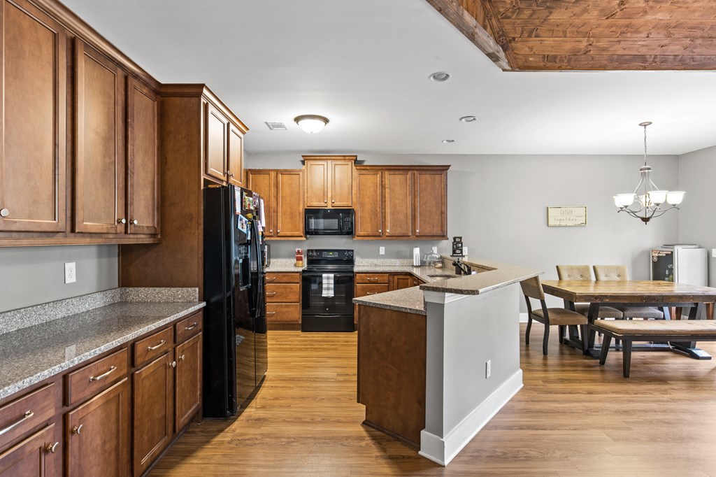 41 Brumby Trail Ellijay, GA 30536 - Photo 21 of 39 a kitchen with stainless steel appliances granite countertop a stove refrigerator sink and cabinets