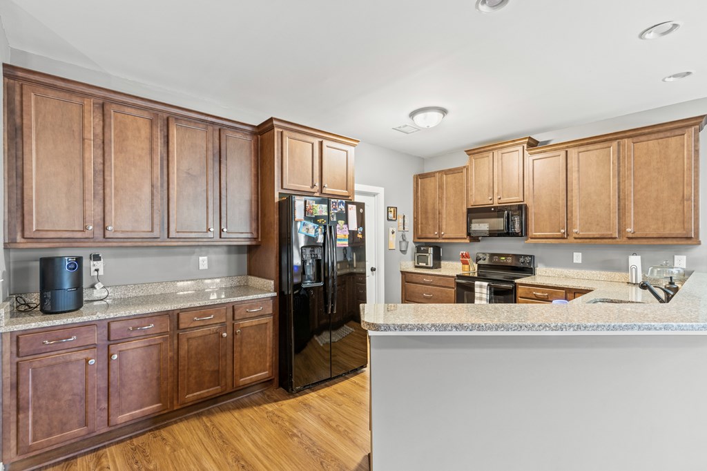 41 Brumby Trail Ellijay, GA 30536 - Photo 22 of 39 a kitchen with stainless steel appliances granite countertop a refrigerator sink and cabinets