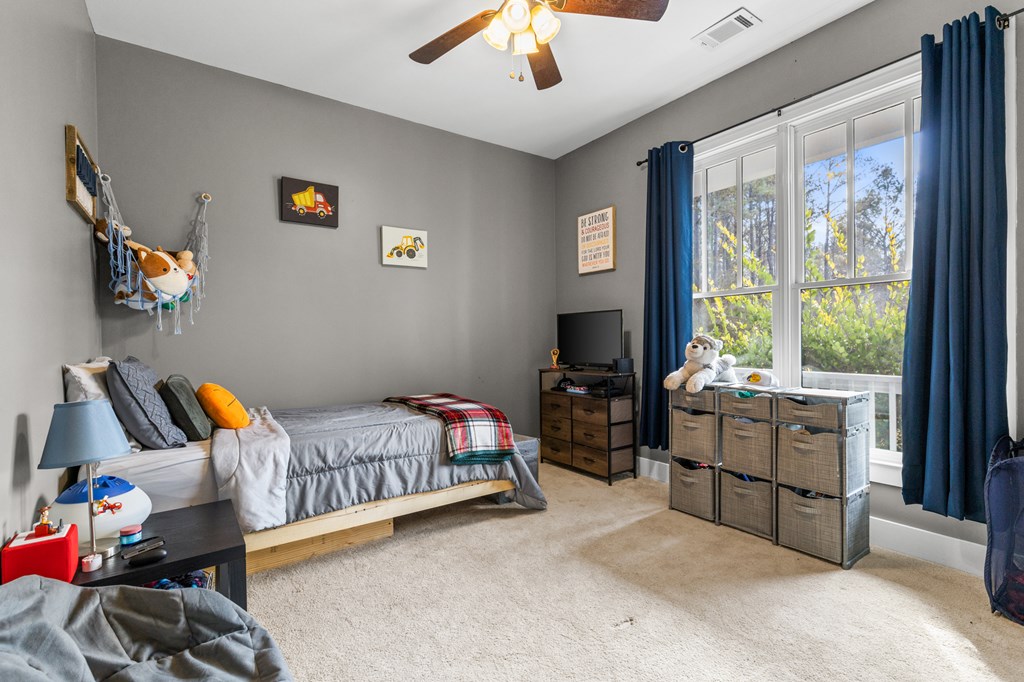 41 Brumby Trail Ellijay, GA 30536 - Photo 24 of 39 a bedroom with furniture and a window