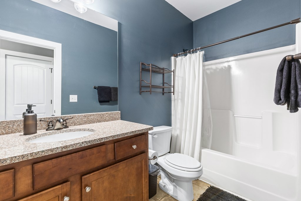 41 Brumby Trail Ellijay, GA 30536 - Photo 26 of 39 a bathroom with a granite countertop sink toilet and shower