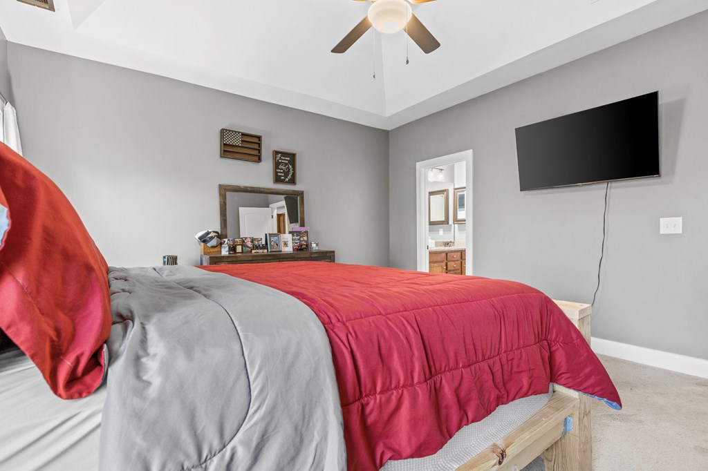 41 Brumby Trail Ellijay, GA 30536 - Photo 28 of 39 a bedroom with a bed and a flat screen tv