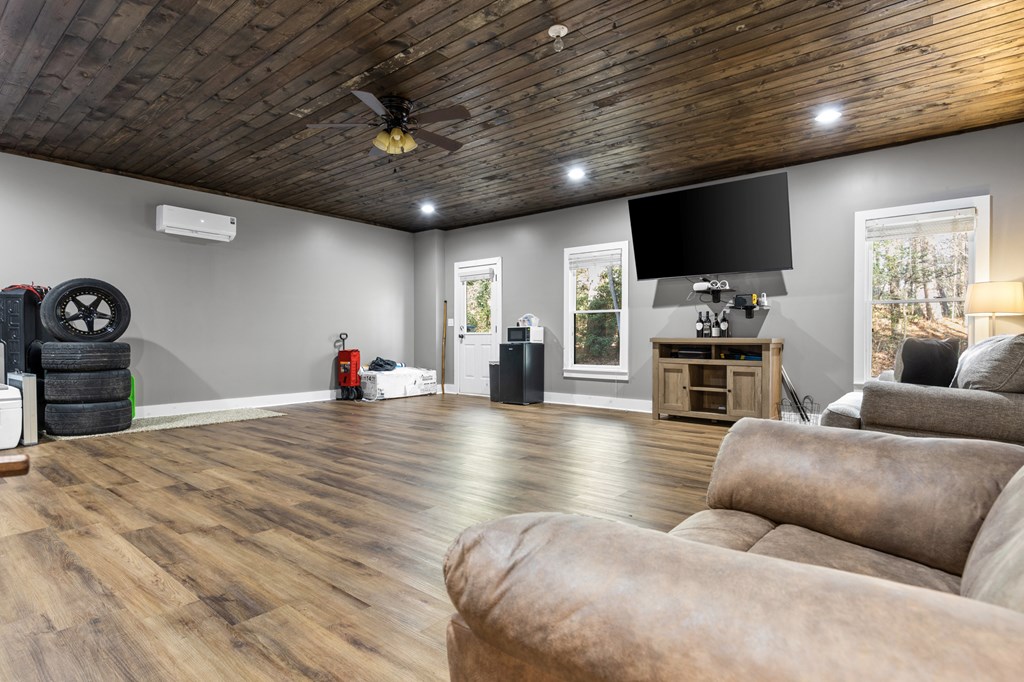 41 Brumby Trail Ellijay, GA 30536 - Photo 33 of 39 a living room with furniture and a flat screen tv