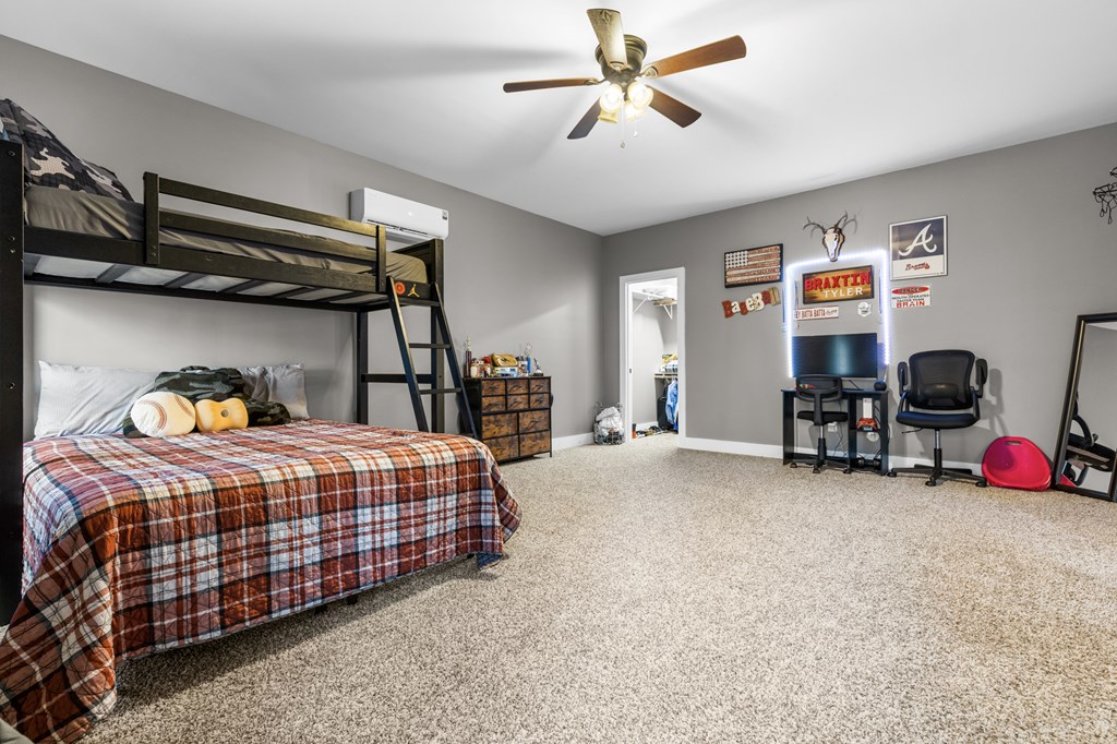 41 Brumby Trail Ellijay, GA 30536 - Photo 36 of 39 a bedroom with bed and a chandelier