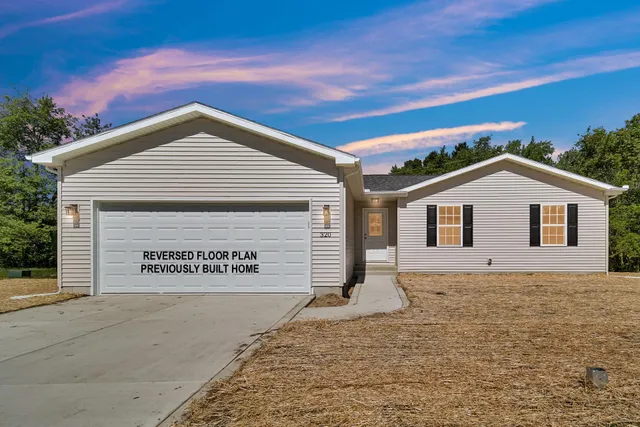 a view of a house with a garage