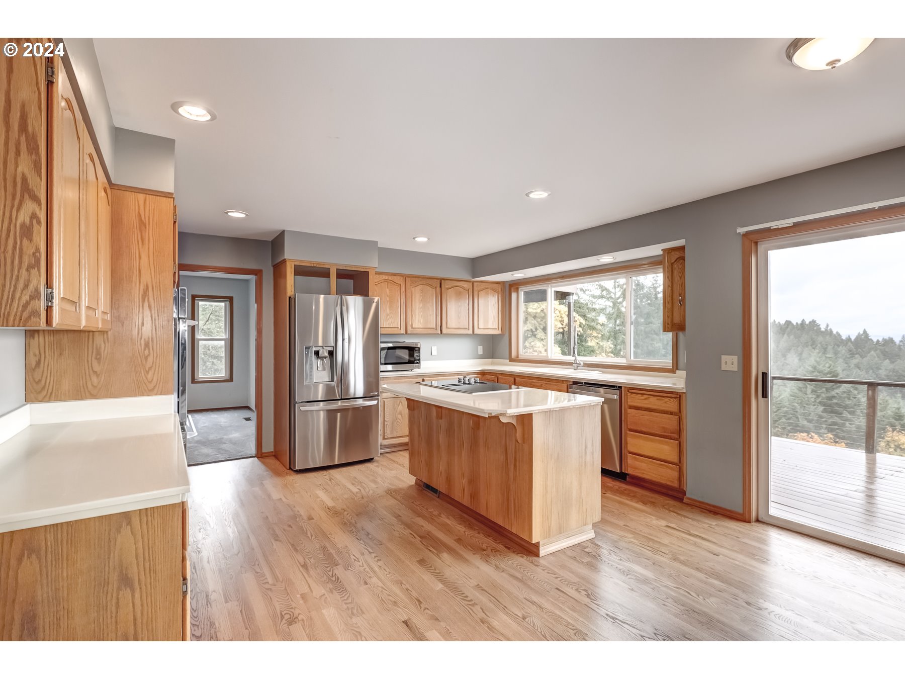 33495 Southwest Riedweg Road Cornelius, OR 97113 - Photo 11 of 48 a large kitchen with kitchen island wooden floors and stainless steel appliances