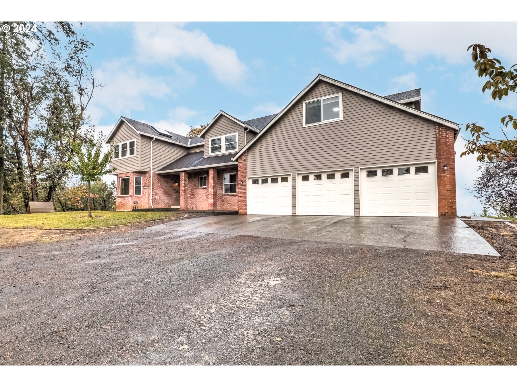 33495 Southwest Riedweg Road Cornelius, OR 97113 - Photo 3 of 48 a front view of a house with a yard and garage