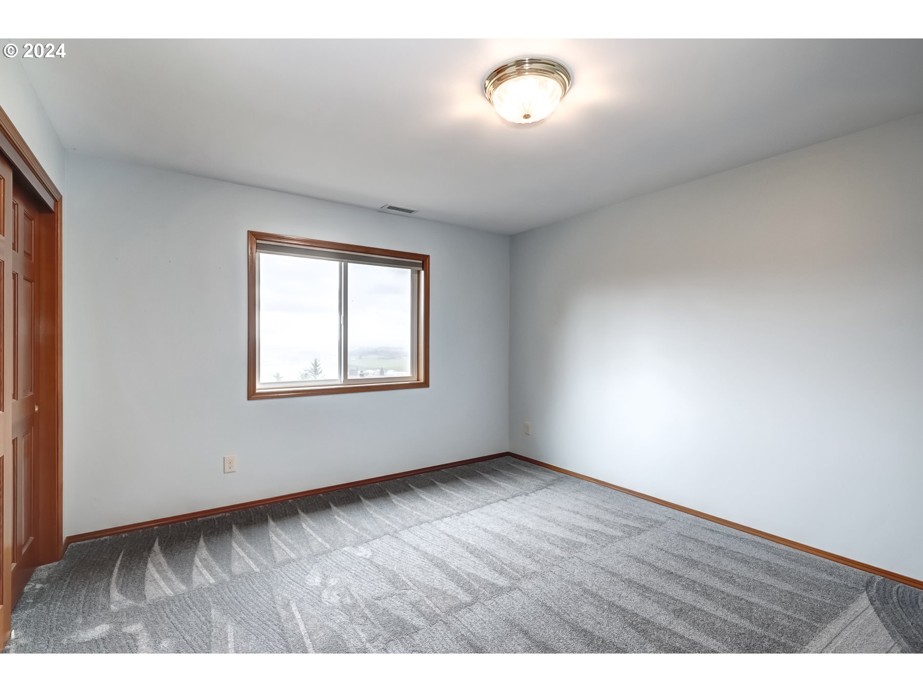 33495 Southwest Riedweg Road Cornelius, OR 97113 - Photo 31 of 48 a view of an empty room with a window