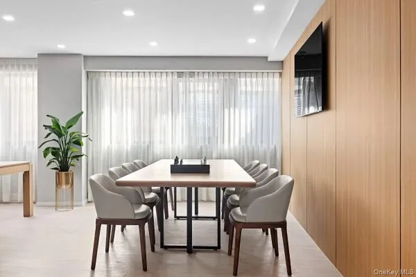 a dining room with furniture and window