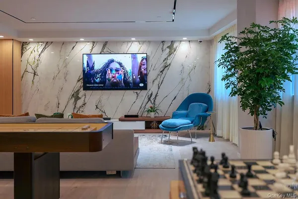 a room with furniture and painting on the wall