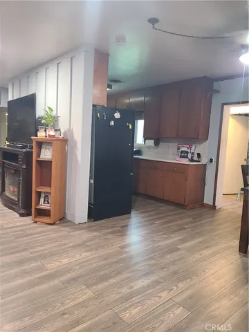 a view of a kitchen with a refrigerator and a stove