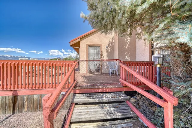 a very nice looking living room with furniture and a large window