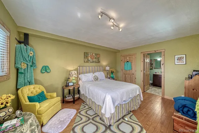 a bedroom with a bed and a book shelf