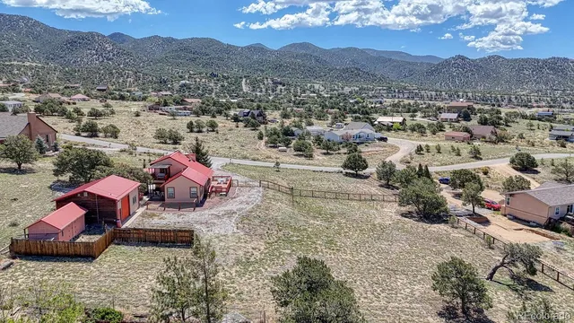 a view of a town with mountains in the background