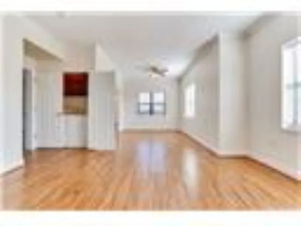 a view of an empty room and window