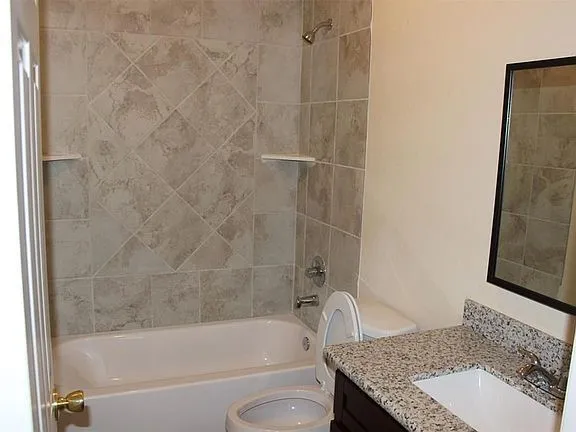 a view of a street with brick walls